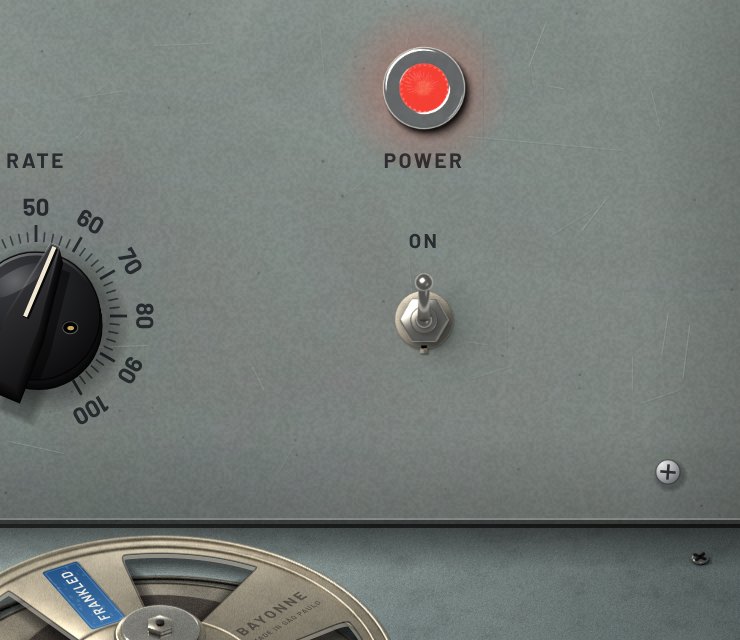 The red faceted power lamp and chrome toggle switch.